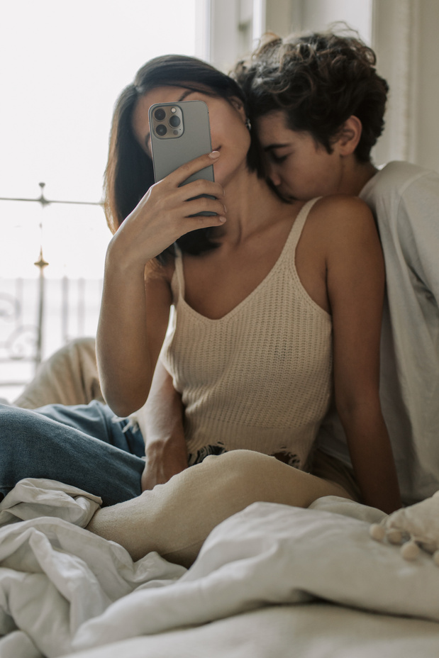 Couple Taking a Selfie in Bedroom